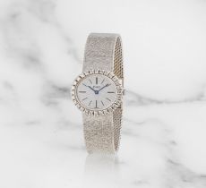 Piaget. A lady's 18K white gold and diamond set manual wind bracelet watch Piaget. Montre bracel...