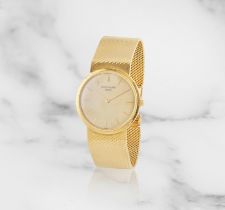 Patek Philippe. An 18K gold manual wind bracelet watch Patek Philippe. Montre bracelet en or jau...