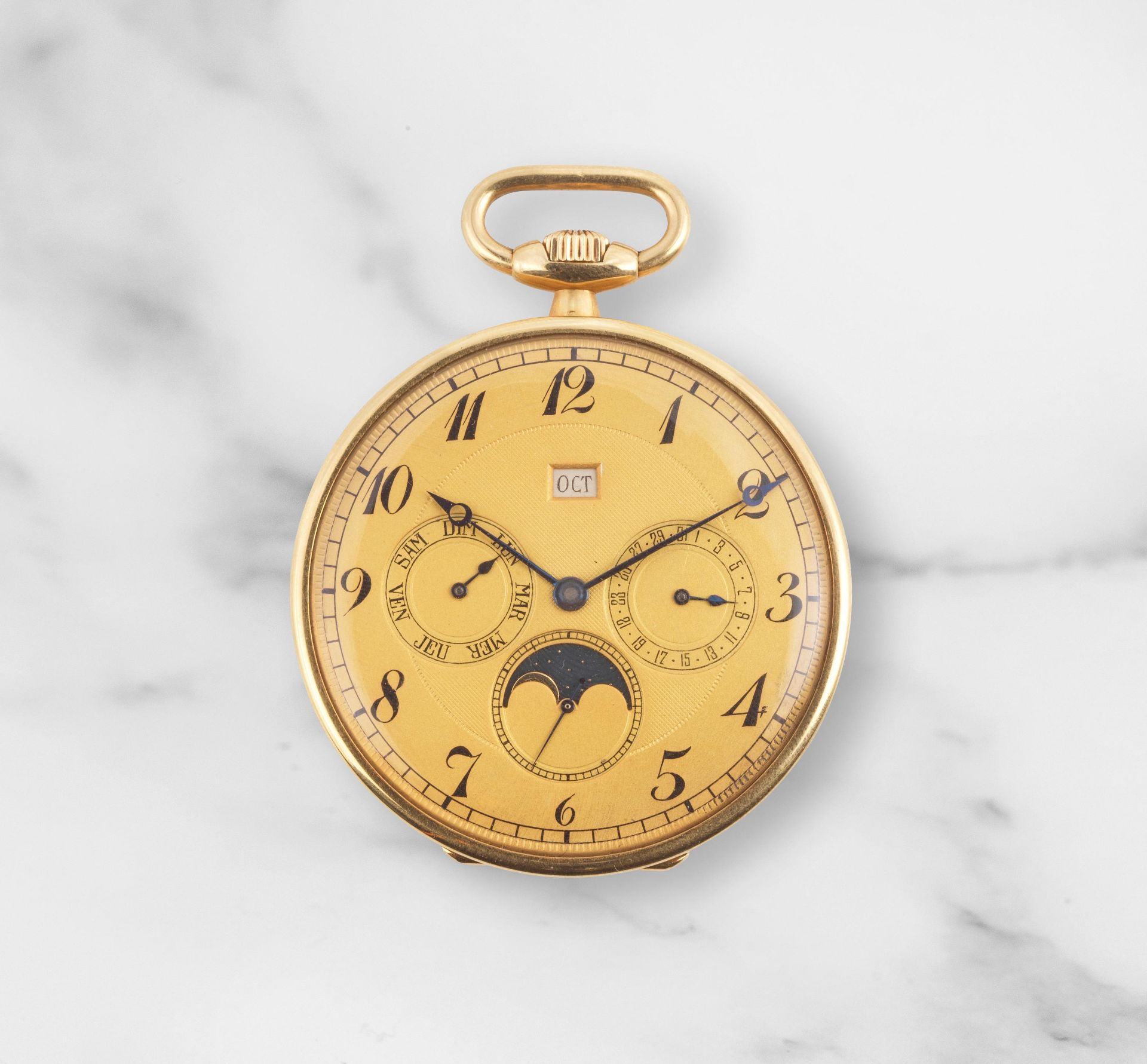 L.Leroy & Cie. An 18K gold keyless wind open face pocket watch with triple calendar and moon pha...