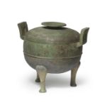 AN ARCHAIC BRONZE RITUAL FOOD VESSEL AND COVER, DING Eastern Zhou Dynasty/Spring and Autumn per...