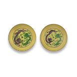 A PAIR OF YELLOW-GROUND GREEN AND AUBERGINE-ENAMELLED 'DRAGON' SAUCER-DISHES Guangxu six-charac...