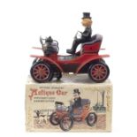 A boxed 'Antique Car' battery-operated tin-plate toy by Toys Nomura (T.N) of Japan, ((3))