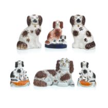 A collection of Staffordshire models of spaniels 19th century