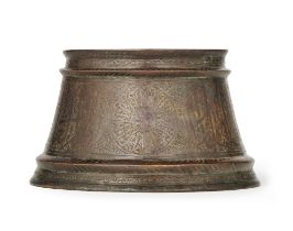 A Mamluk silver-inlaid bronze candlestick base Egypt or Syria, 14th Century