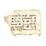 A leaf from a manuscript of the Qur'an written in kufic script on vellum Near East or North Afri...