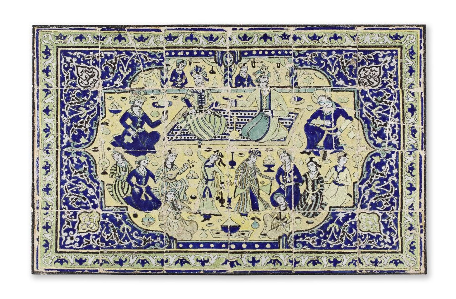 A Qajar cuerda seca pottery tile panel depicting an assembly of Shah 'Abbas with dancers and mus...