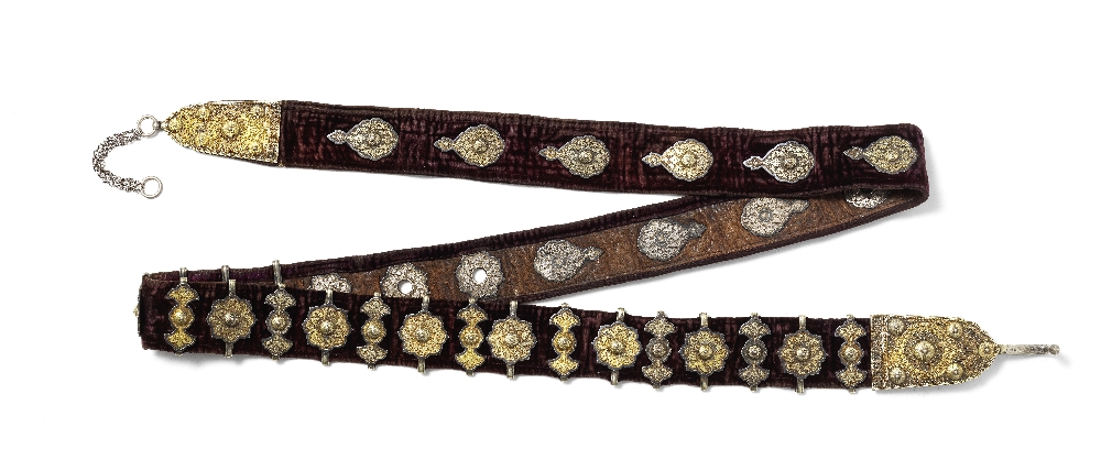 A fine parcel-gilt and niello silver mounted velvet belt Central Asia, dated 1909