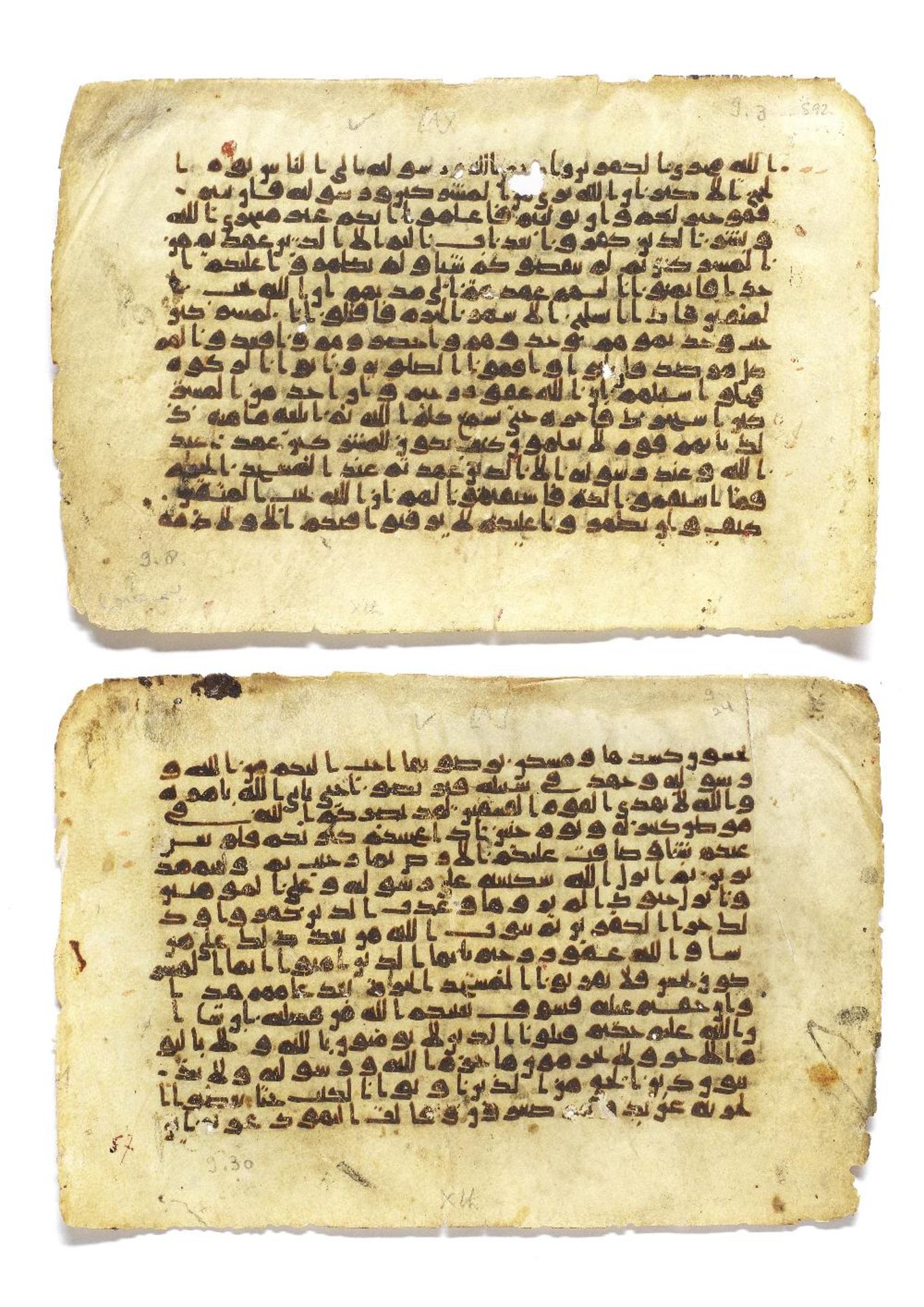 Two consecutive leaves from a manuscript of the Qur'an written in kufic script on vellum Near Ea...