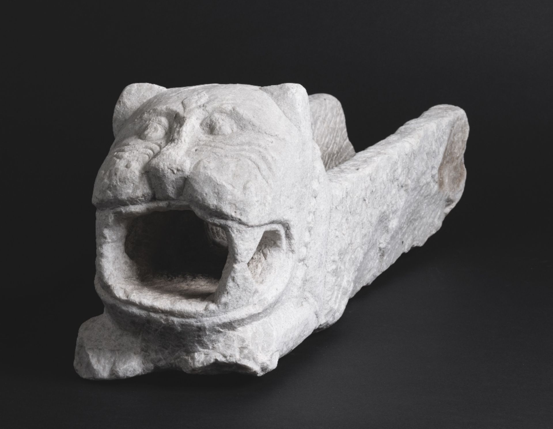 A carved marble waterspout in the form of a lion Probably Sicily, 12th Century