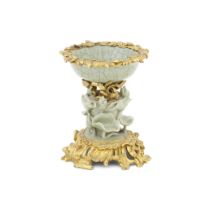 A French ormolu mounted Chinese shallow porcelain bowl mounted on a celadon porcelain 'lotus' ba...