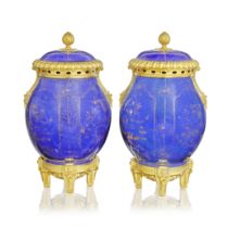 A pair of late Louis XV ormolu mounted powder-blue and gilt porcelain jars and covers The porcel...