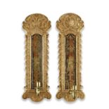 A pair of George I-style carved giltwood and verre &#233;glomis&#233; girandolesThe verre &#233;...