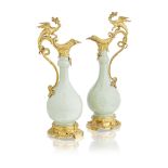 A pair of gilt bronze mounted Chinese green glazed porcelain ewers in the Louis XV taste The por...