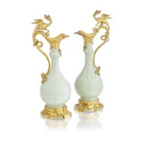 A pair of gilt bronze mounted Chinese green glazed porcelain ewers in the Louis XV taste The por...