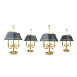 A set of four French gilt metal three light bouillotte lamps In the Empire style (4)