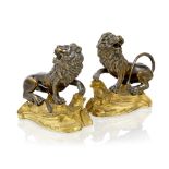 A pair of Louis XV ormolu and patinated bronze models of seated lion presse-papiers Mid-18th cen...