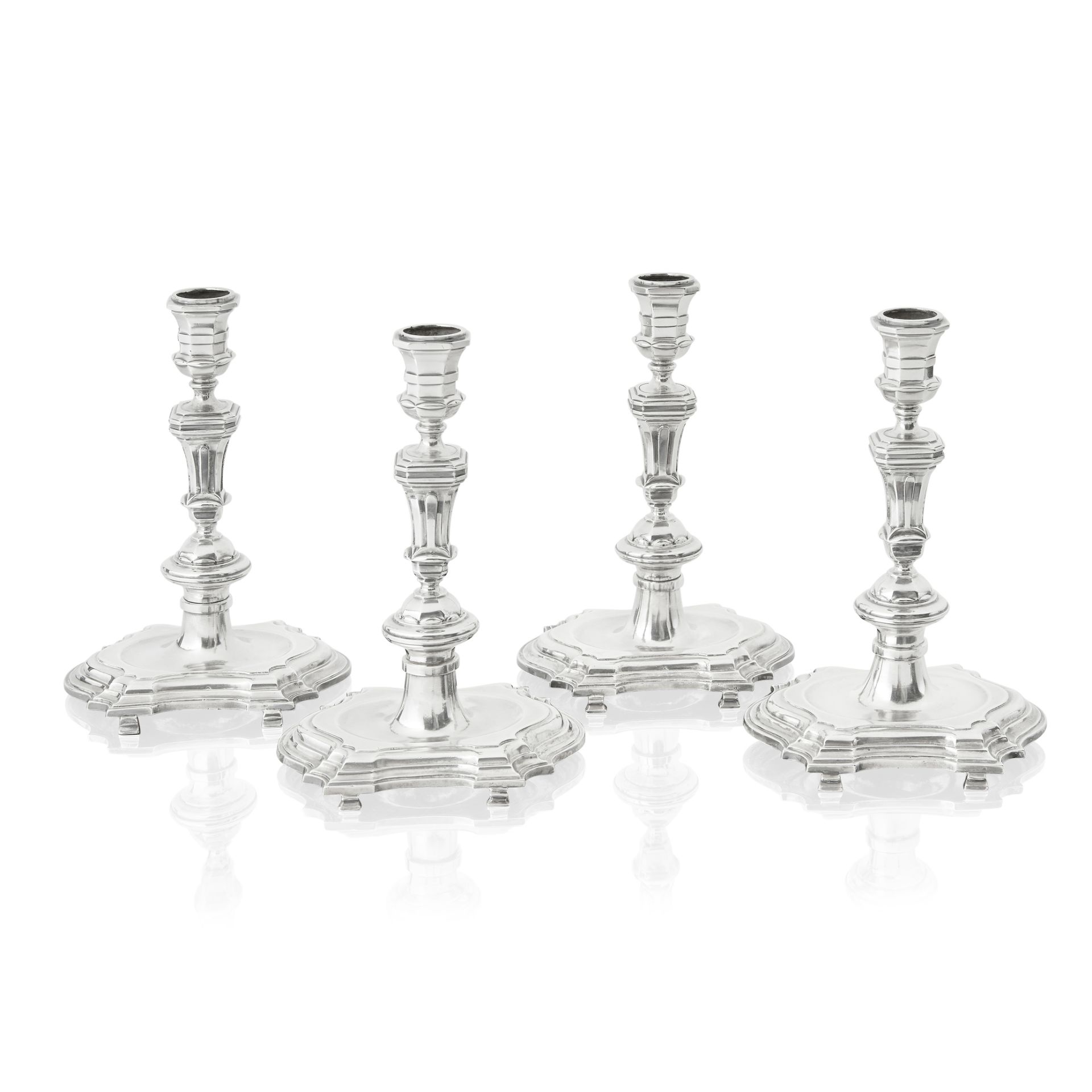 A matched set of four 18th century Dutch cast silver candlesticks Three with maker's mark for Wi...