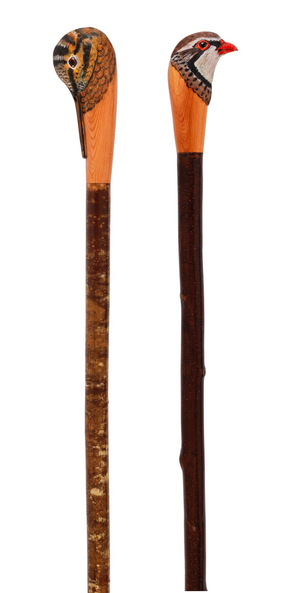Two carved sporting staffs by Mark Richards (2)