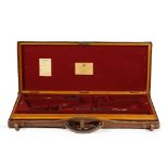 A brass-mounted oak and leather double guncase by J. Purdey & Sons