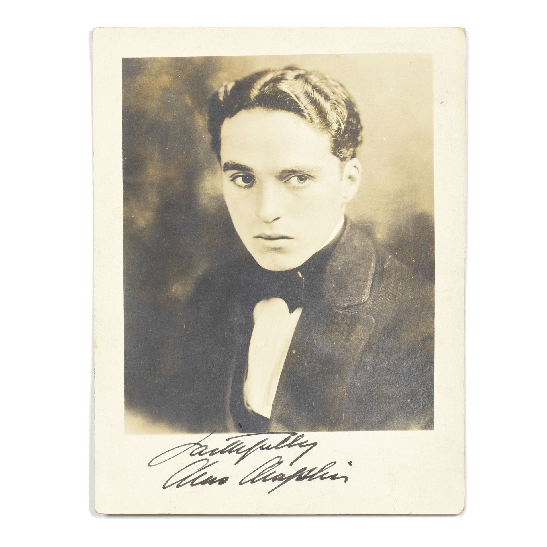 Charlie Chaplin: A Signed Postcard Photograph, circa 1910,