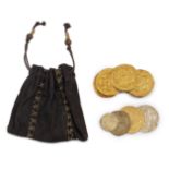 Pirates Of The Caribbean: A Group Of Sixteen Prop Coins and Pouch From Curse Of The Black Pearl,...