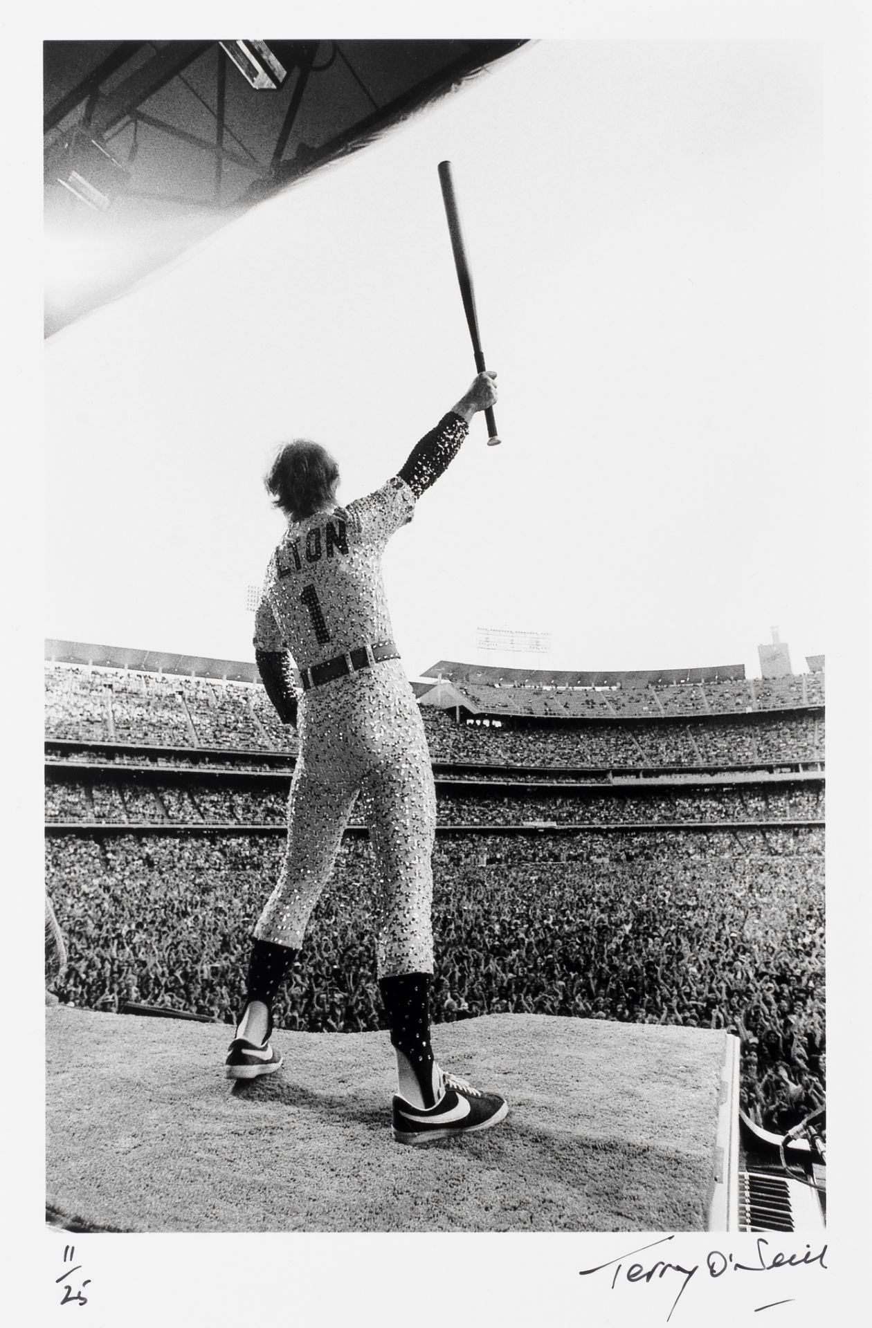 Terry O'Neill (British, 1938-2019): Elton John, Dodgers Stadium, 1975, printed later,