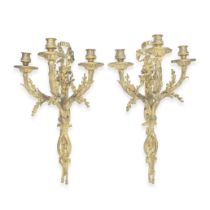 A pair of late 19th century French gilt bronze three light wall appliques Perhaps in the manner...