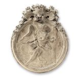 An Italian sculpted terracotta tondo relief or bozzetto depicting an angel holding the Sudarium