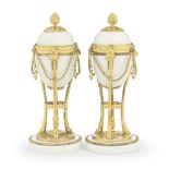 A pair of unusual late 18th century gilt bronze and white opaque glass cassolettes The gilt bro...