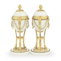 A pair of unusual late 18th century gilt bronze and white opaque glass cassolettes The gilt bro...