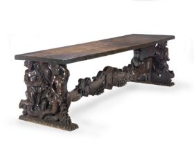 A large Italian 19th century Baroque revival walnut trestle or dining table