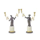 A pair of late 18th / early 19th century gilt and patinated bronze figural candelabra Probably F...