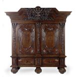 A large German walnut schrank or wardrobe Early 18th century but apparently with some later elem...