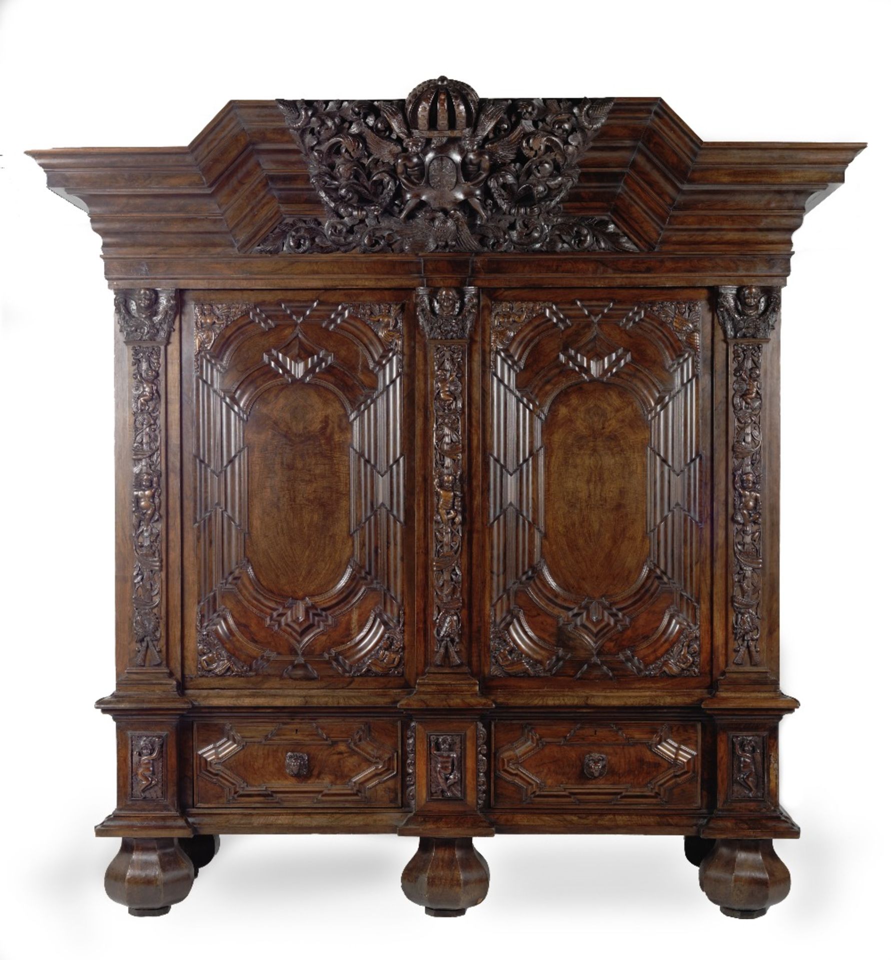 A large German walnut schrank or wardrobe Early 18th century but apparently with some later elem...