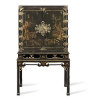 A George I japanned and engraved gilt brass mounted cabinet on a later stand The cabinet: 1710-1...