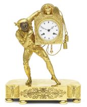 A good early 19th century French gilt and patinated Harlequin clock The movement numbered 4543.