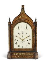An impressive first half of the 19th century brass-inlaid mahogany quarter chiming table clock Fro