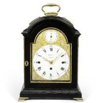 An 18th century brass bound, ebonised, triple-pad top quarter chiming table clock with enamel dials