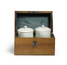 A pair of Saint-Cloud tobacco jars and covers in a fitted wooden travelling case, circa 1740-50