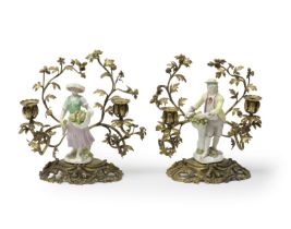A pair of Meissen gilt-metal mounted figural candelabra, the porcelain third quarter 18th century