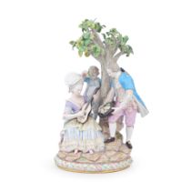 A late 19th century Meissen porcelain figural group of a courting couple and a young boy beside ...
