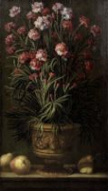School of Valencia, early 18th Century A terracotta vase of carnations on a stone ledge with quince