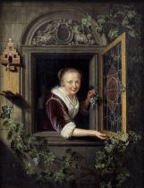 Follower of Gerrit Dou (Leiden 1613-1675) Young woman at a window holding a bunch of grapes