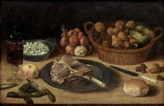 German School, 17th Century Still life of a basket of nuts with onions, bread and beans on a tab...