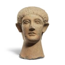 An Etruscan terracotta votive head of a boy