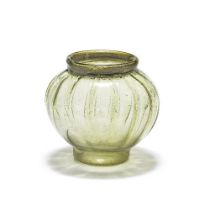 A Gallo-Roman yellow-green glass ribbed spherical jar