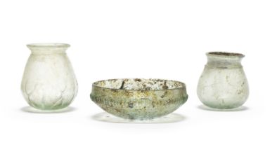 Two Roman green glass beakers and a Roman green glass ribbed bowl 3