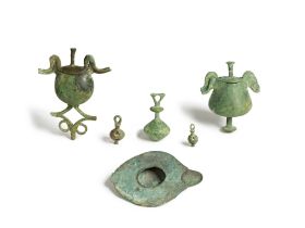 A group of two Greek bronze pyxides, three bronze pendants, and an Italic bronze lamp 5