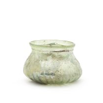 A Gallo-Roman green glass ribbed jar