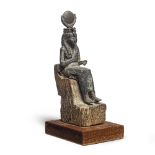 An Egyptian bronze figure of Isis with inlaid eyes on a wood throne